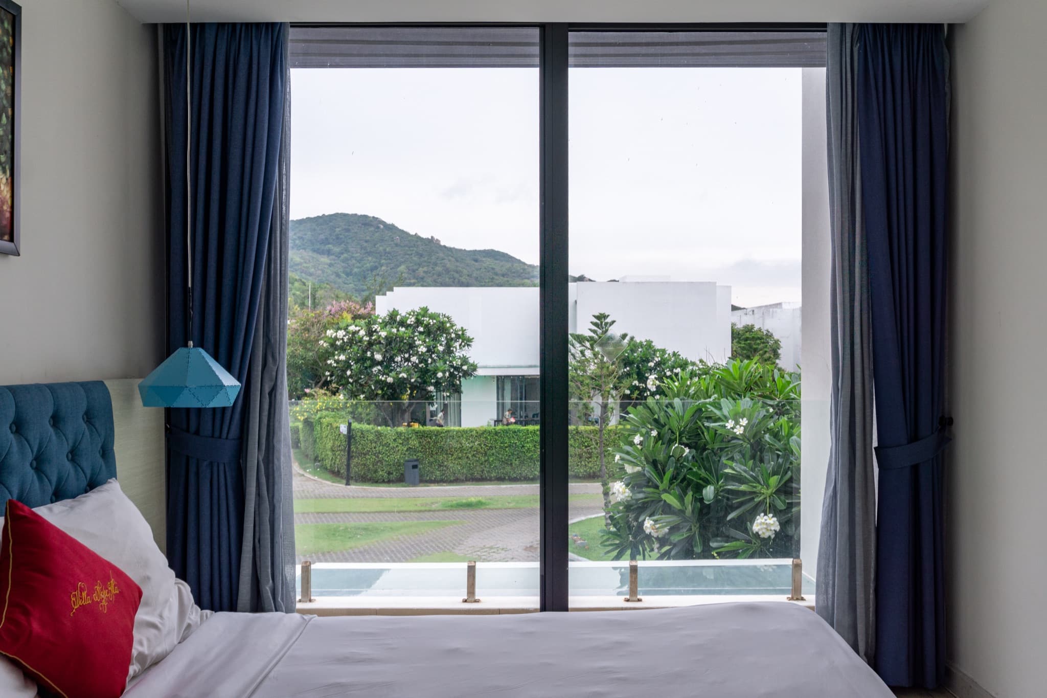 Bedroom two — view over the resort gardens to the hills