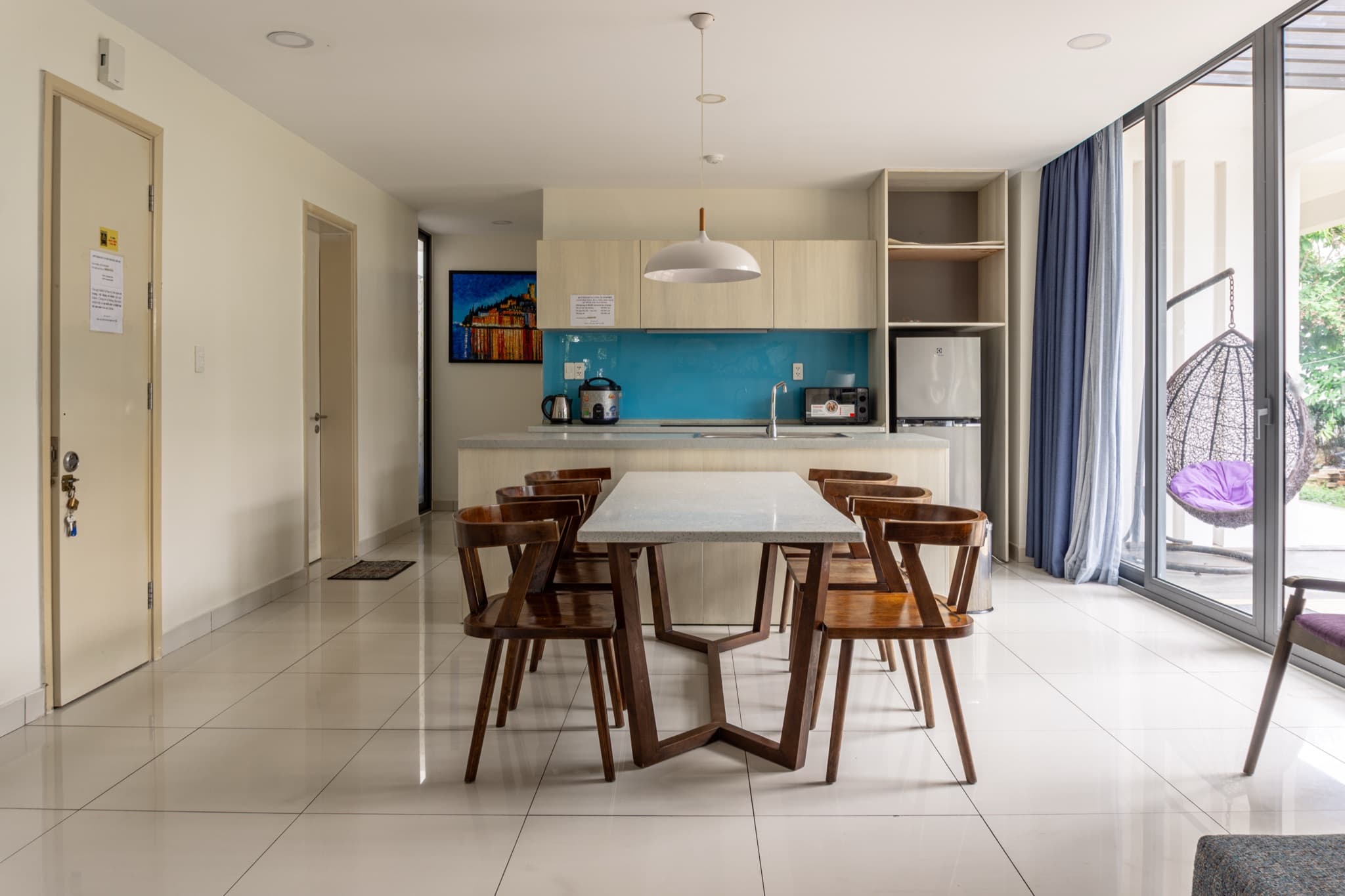 Dining table for eight beside the open kitchen