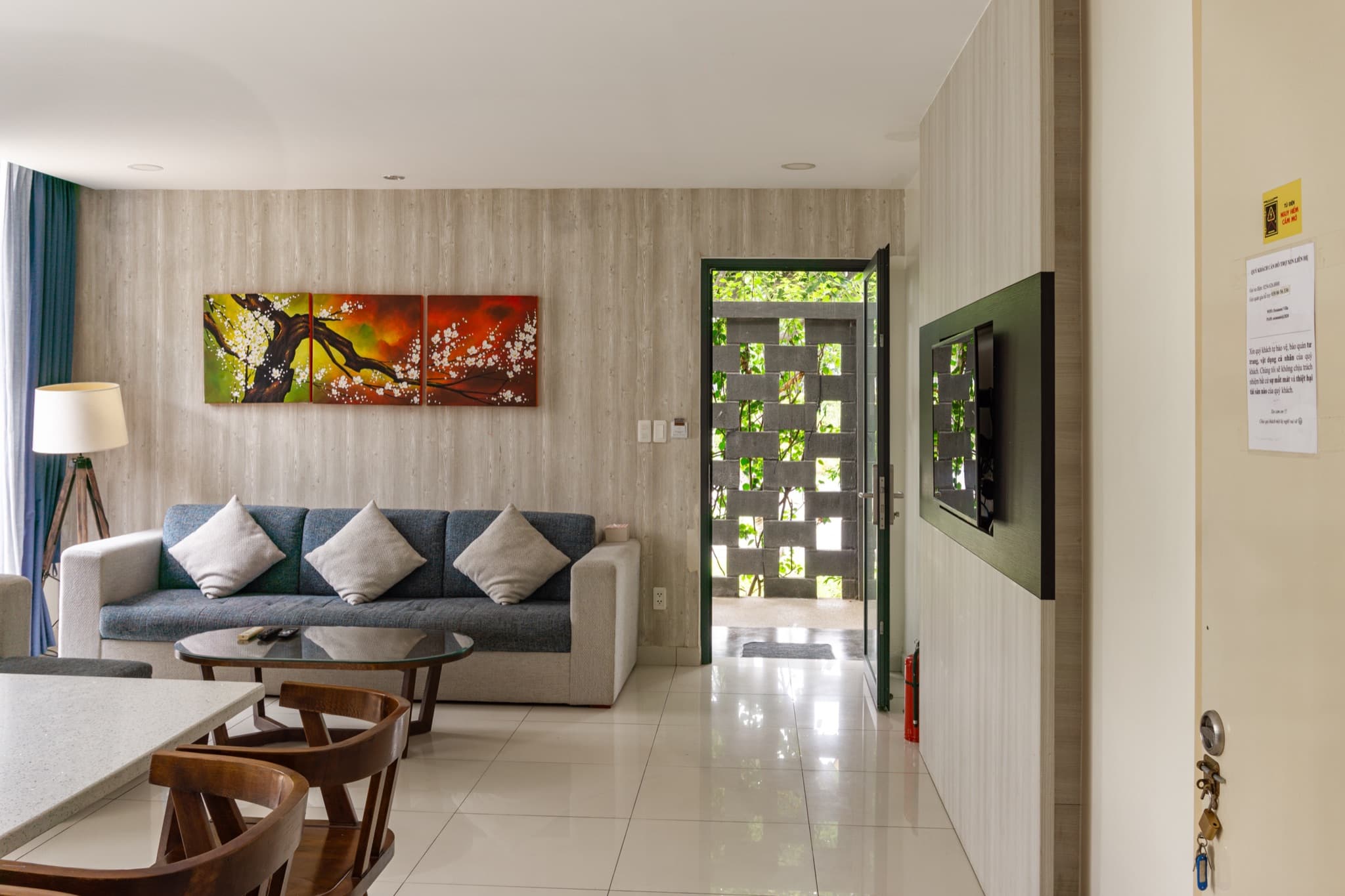 Living room seating by the glass doors