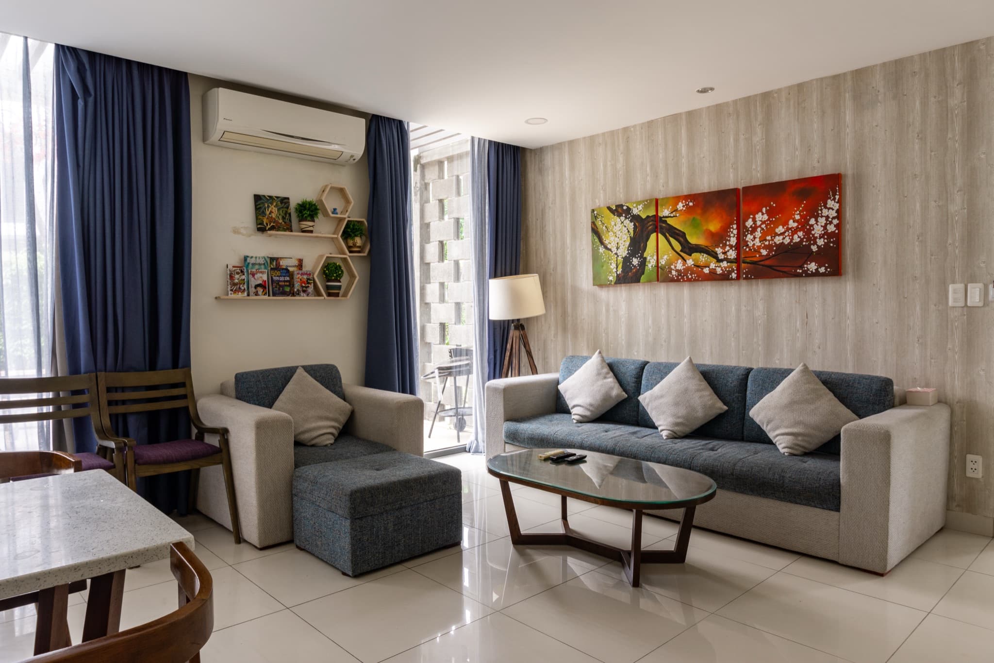 Living room with sofas and glass doors to the patio